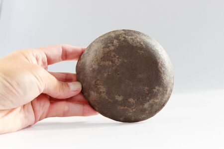 small plate in the shape of a dragons eye is made using the technique of mixing two clays of Nerikomi.の写真素材