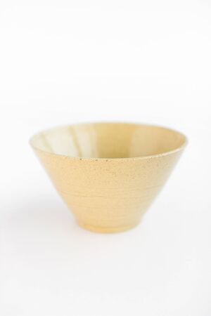 beige clay plate on a white background. minimalism style. handworkの写真素材