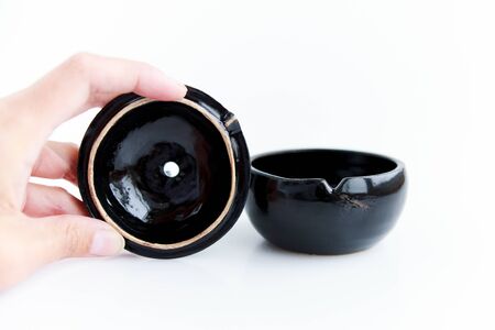 black clay pomegranate on a white background. original casket with a cover in the form of a pomegranate.の写真素材