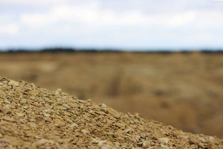 limestone mining. small stones lie mountain in the foreground. mining. construction materialの写真素材