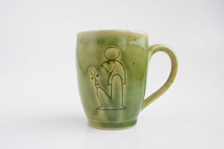 mug with the image of the god Ra. Author's ceramics. Color Celadon. egyptian symbolismの写真素材
