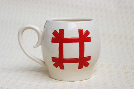 handmade ceramic bowl. clay covered with glaze and passed two firing. ancient Slavic sign Healer.の写真素材