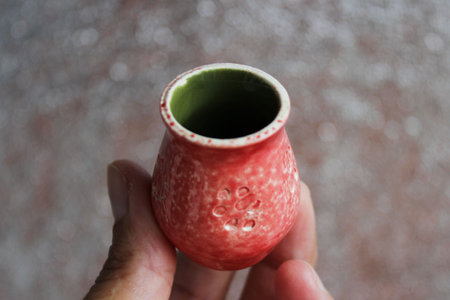 small handmade red clay with cat paws pot for making wishes or flowers from boutonnieres. Decor engobe, covered with transparent glaze, two firingの写真素材