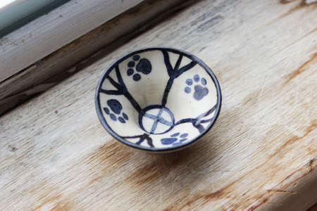 small ceramic plate with cat paws. handmade. in a single copy.の写真素材