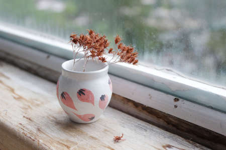 small handmade white clay pot for making wishes or flowers from boutonnieres. Decor engobe, covered with transparent glaze, two firing.の写真素材