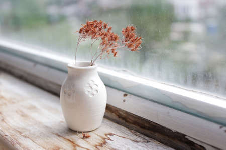 small handmade white clay pot with cat paws for making wishes or flowers from boutonnieres. Decor engobe, covered with transparent glaze, two firing.の写真素材