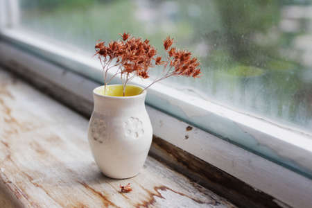 small handmade white clay pot with cat paws for making wishes or flowers from boutonnieres. Decor engobe, covered with transparent glaze, two firing.の写真素材