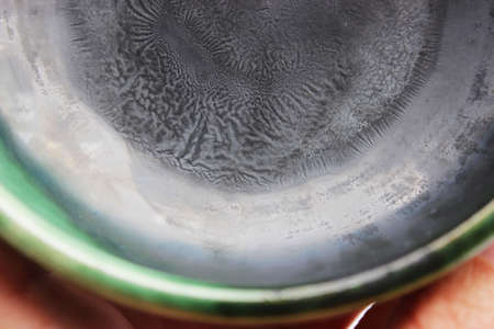 pebbled glaze assembly at the bottom of the ceramic plate. spectacular glaze with the addition of several metal salts. handmade. wrinkles are like the growth of germs in a petri dish.の写真素材