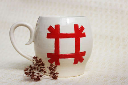 handmade ceramic bowl. clay covered with glaze and passed two firing. ancient Slavic sign Healer.の写真素材
