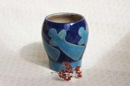 handmade ceramic vase. clay covered with engob, glaze and passed two firingの写真素材