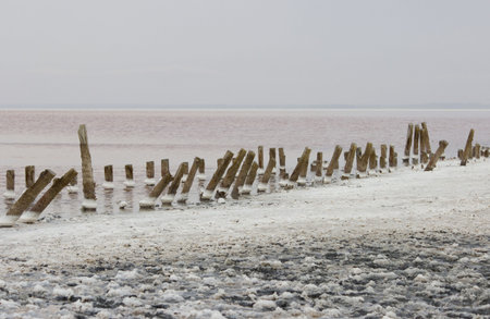 pink salt lake - a former place for salt mining. therapeutic diet. wooden beams - the remains of the...