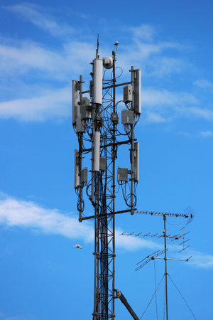 antenna for cellular communication in the city against the sky. many wave catchers look in different directions. rectangular locators and contactsの写真素材