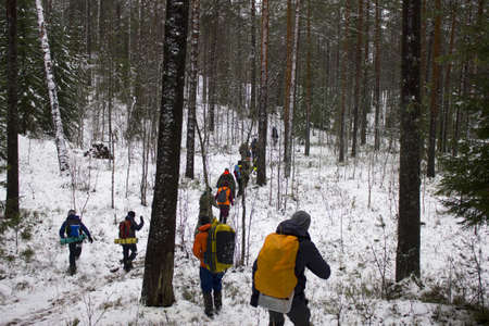 First aid training. People walk the route where various injuries in the winter forest will be played outの写真素材