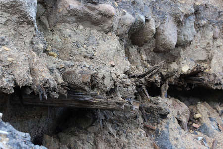 historical layer of the road, discovered during the expansion and repair of the road in Gatchina, Russiaの写真素材
