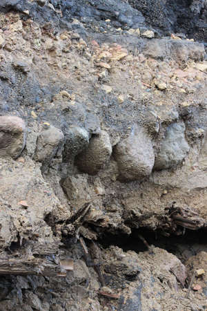 historical layer of the road, discovered during the expansion and repair of the road in Gatchina, Russiaの写真素材
