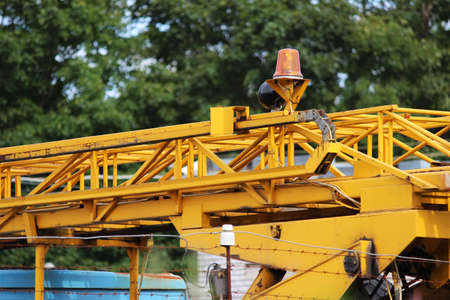 yellow arrow on an industrial vehicle parked behind a fence. city sketch.の写真素材