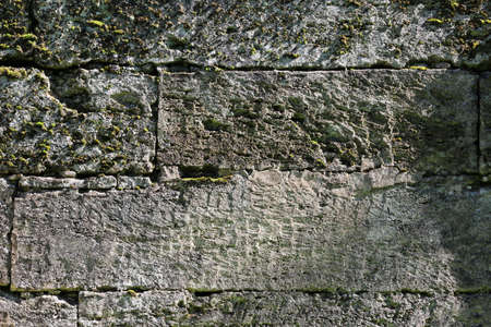 background from ancient stone. ancient wall that separates two parts of the park from each other. Eighteenth century. Stone and historyの写真素材