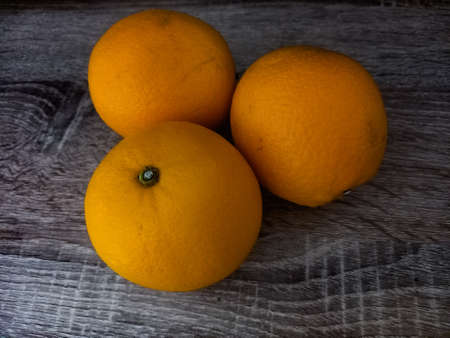 Orange fruit on a wood backgroundの写真素材
