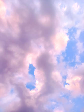 Clouds in the sky drifting away in a light breeze.の写真素材