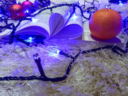 Christmas Decoration and book with opened pages.の写真素材