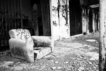 chair in an abandoned ghost city black and whiteの写真素材