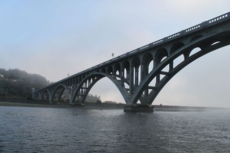 Foggy view of the bridge from the riverの写真素材