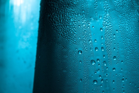 pitcher filled with ice cold water with condensation on the outsideの写真素材