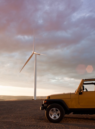 huge wind mills in southern idaho at sunsetの写真素材