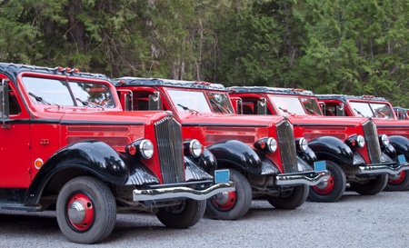 line of restored old 1930's trucks used as tour buses todayのeditorial素材
