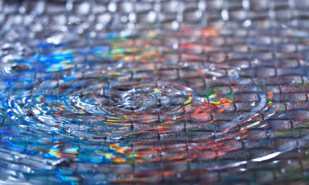 different water drops splashing with different lights in the back and a textutized background