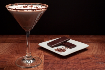chocolate martini garnished with chocolate power rim and chocolate shavings on creamの写真素材