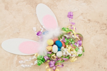 Easter decorations close up with ears and eggs with multiple colorsの写真素材