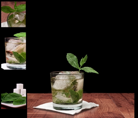 Mint julep isolated on a black background served on a bar top garnished with fresh mintの写真素材