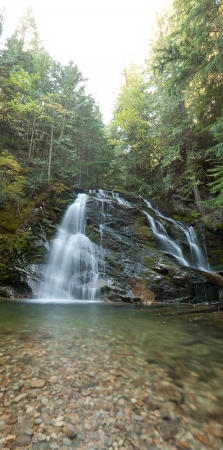 snow creek falls in north idaho late autumn with rocks and peaceful sceneryの写真素材