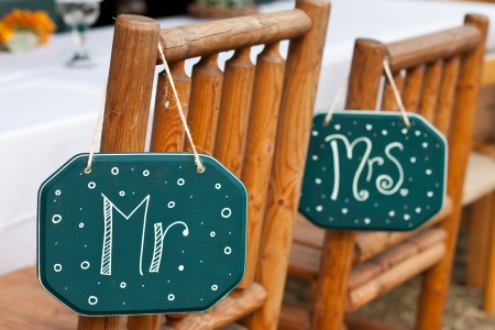 mister and misses signs on wooden chairs for a country style weddingの写真素材