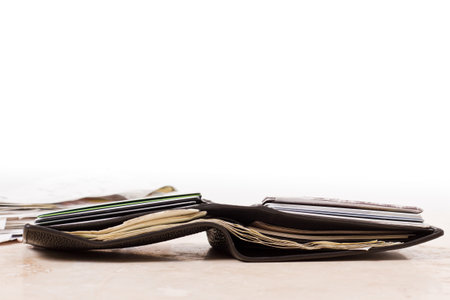 a close up view of a wallet with money and credit cards