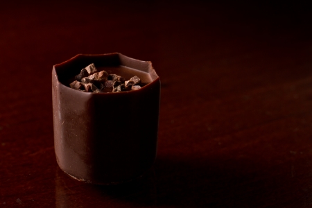 small decadent chocolate serving in a dark set upの写真素材