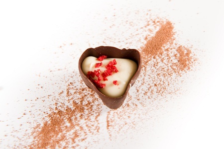 dark chocolate with cocoa powder on a white backgroundの写真素材