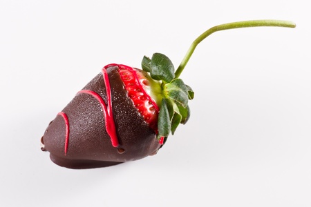 dark chocolate covered strawberry on a white backgroundの写真素材