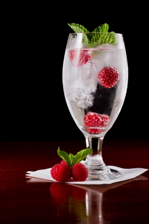 refreshing ice cold water with fresh raspberries and mintの写真素材