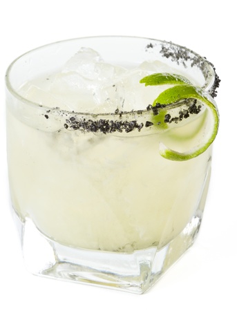 closeup of a margarita garnished with smoked black lava salt isolated on a white backgroundの写真素材