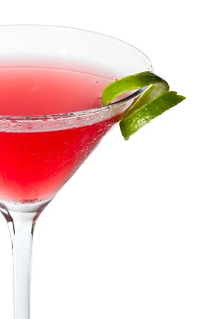 isolated cosmopolitan on a white background garnished with a lime twistの写真素材