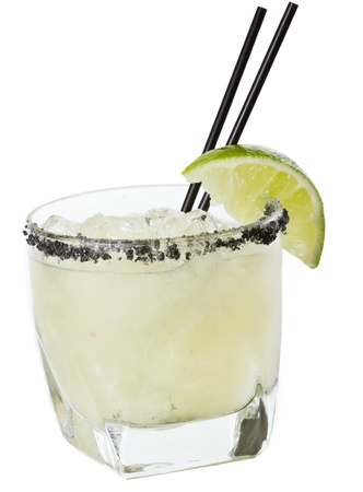 closeup of a margarita garnished with smoked black lava salt isolated on a white backgroundの写真素材