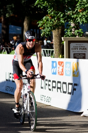 COEUR D ALENE, ID -  JUNE 23: Michael Egan Triathlete on the bike part of the ironman triathlon, June 23 2013 in Coeur d' Alene Idahoのeditorial素材