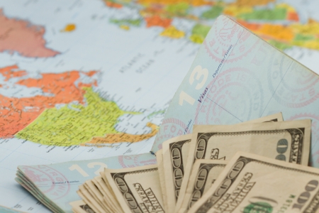 American passport with  american currency and a map as a backgroundの写真素材