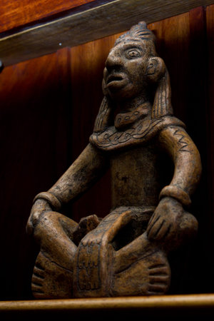 replica of a mayan artifact on a shelf in the tropical rain forest of Belize
