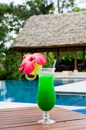 fresh tropical juice cocktail served pool side in Belizeのeditorial素材
