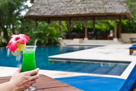 fresh tropical juice cocktail served pool side in Belizeのeditorial素材