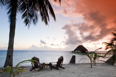 Beautiful tranquil beach sun rise in southern Belizeの写真素材