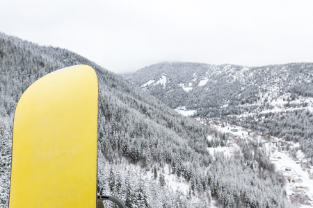 snowboard on the way to the top of the mountain in a cable car at high elevationの写真素材